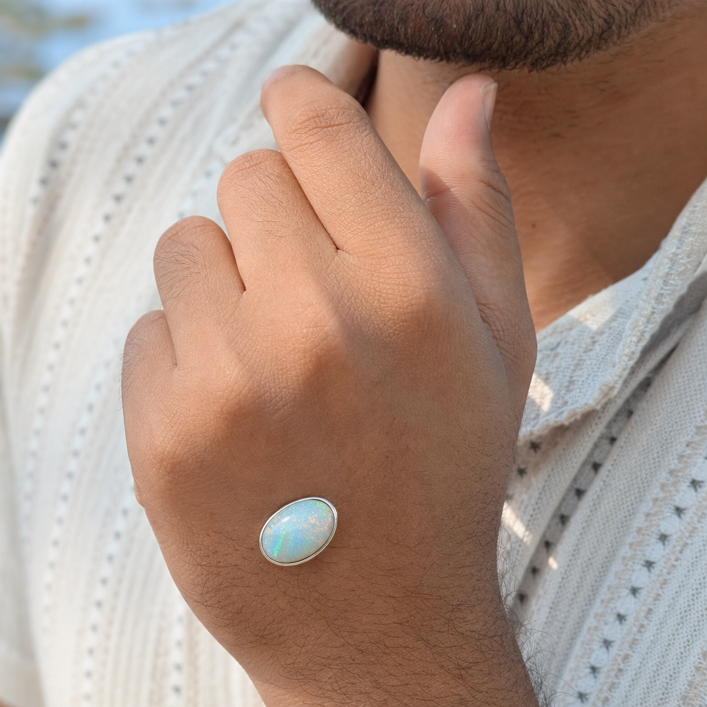 Australian Fire Opal man wearing gemstone ring