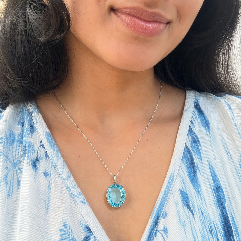 Blue Topaz woman wearing gemstone pendant