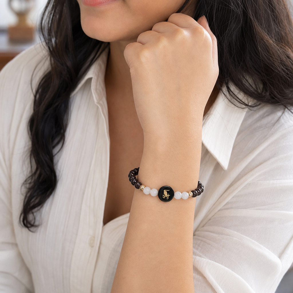 Woman wearing Capricorn (मकर राशि) Zodiac Garnet & Milky Quartz Bracelet for Women