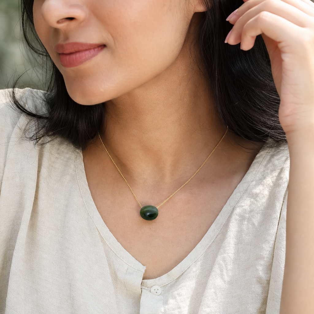 Cat's Eye woman wearing gemstone pendant
