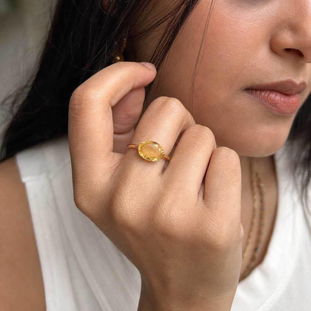 Citrine woman wearing gemstone ring