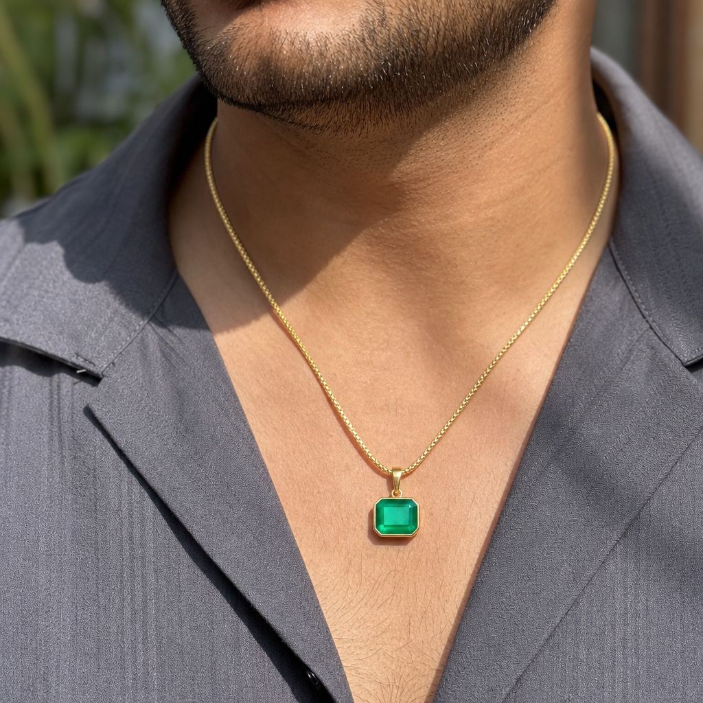Emerald man wearing gemstone pendant