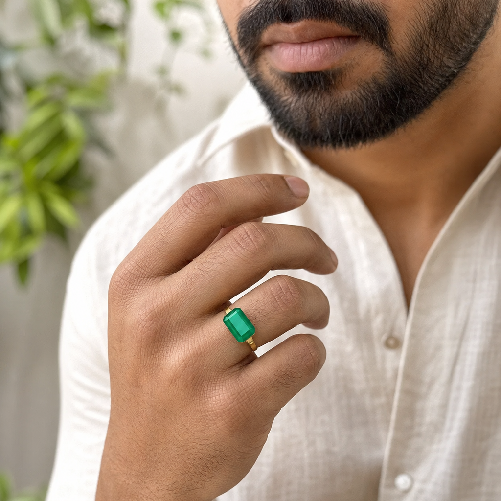 Emerald man wearing gemstone ring