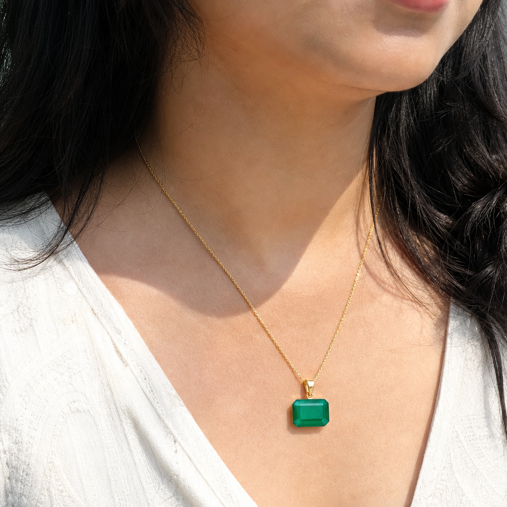 Emerald woman wearing gemstone pendant