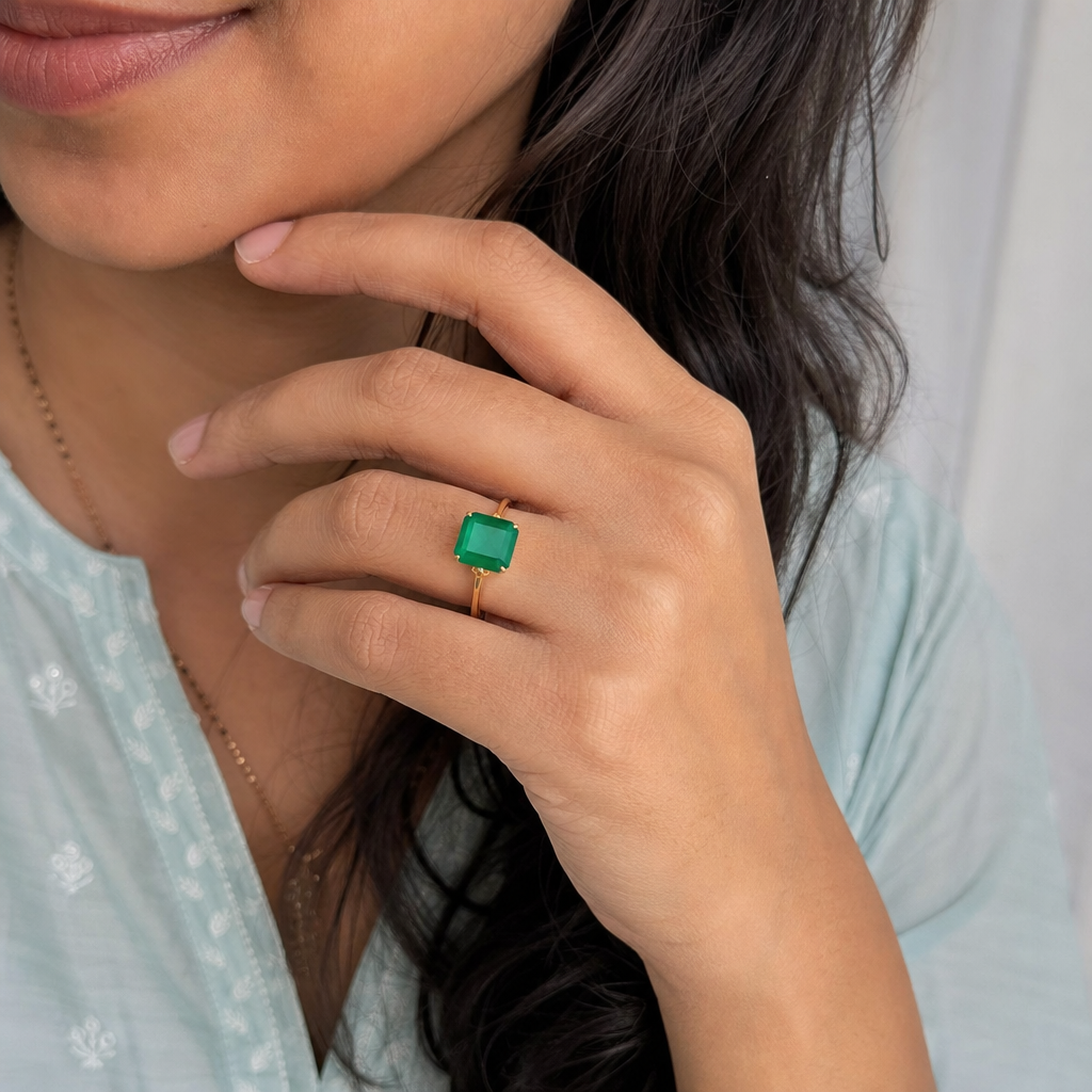Emerald woman wearing gemstone ring