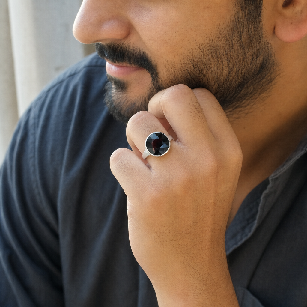 Garnet man wearing gemstone ring