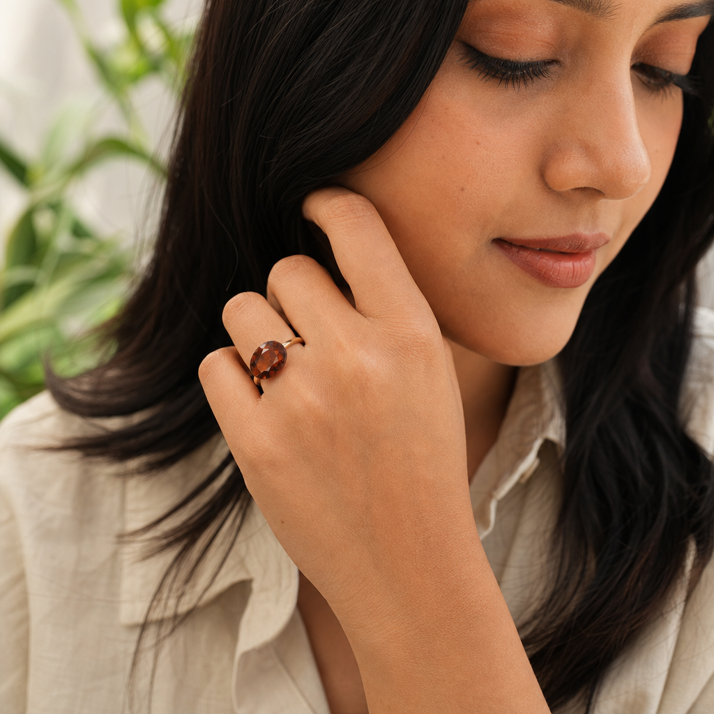 Hessonite woman wearing gemstone ring