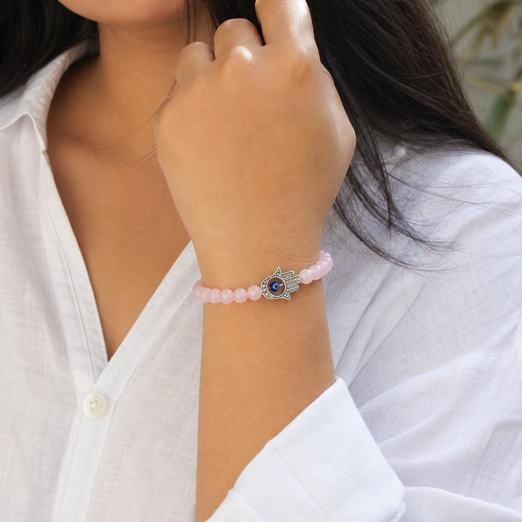 Woman wearing Love Attraction with Evil Eye Hamsa Bracelet
