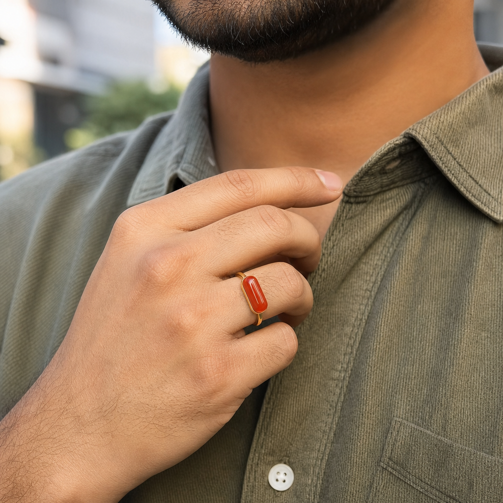 Moonga man wearing gemstone ring
