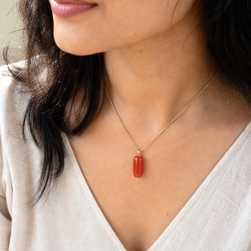 Moonga woman wearing gemstone pendant