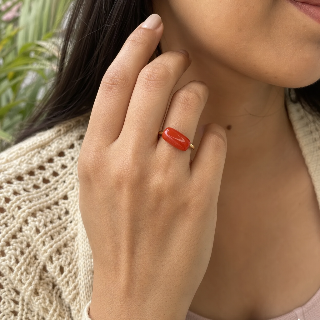 Moonga woman wearing gemstone ring