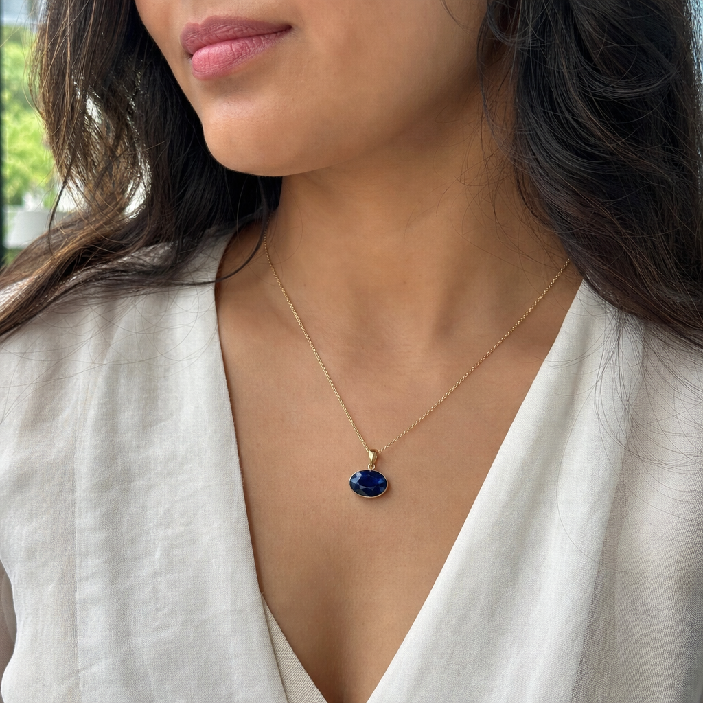 Neelam woman wearing gemstone pendant