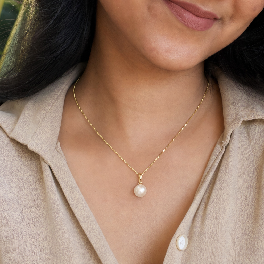 Pearl woman wearing gemstone pendant