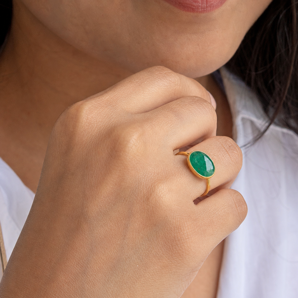 Premium Emerald woman wearing gemstone ring
