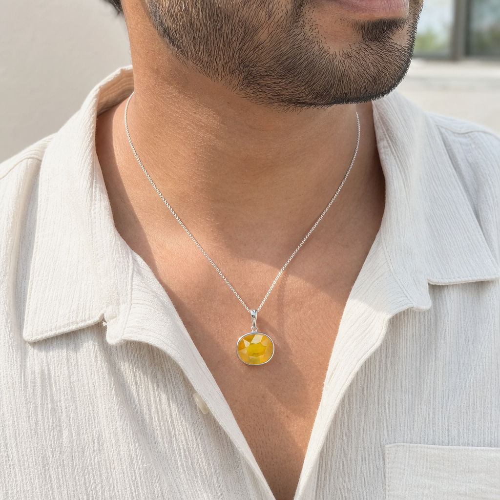 Pukhraj man wearing gemstone pendant