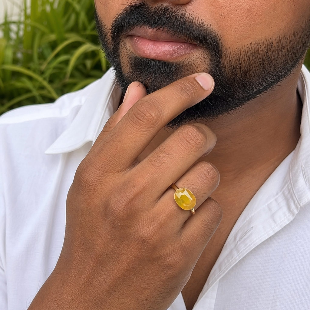 Pukhraj man wearing gemstone ring