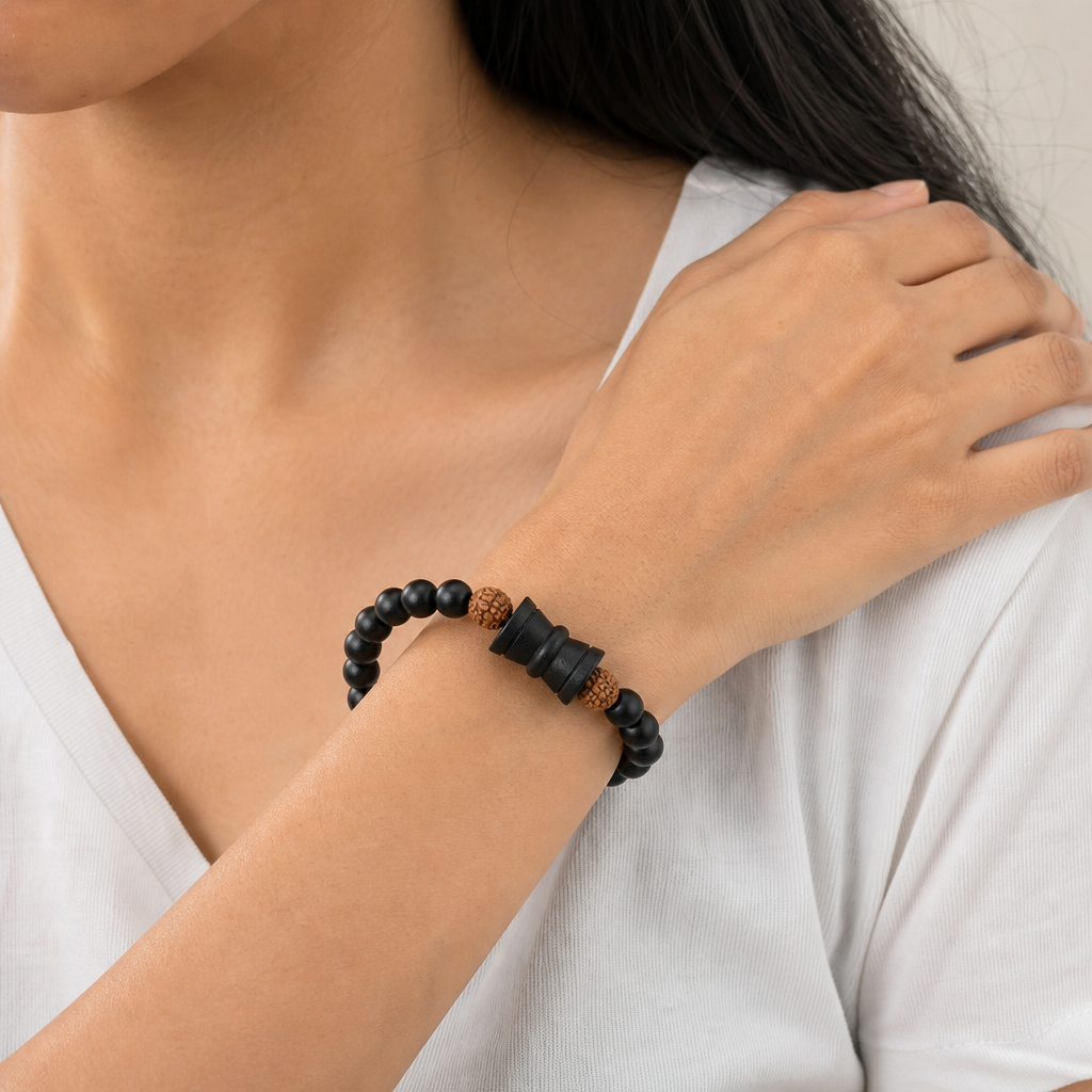 Woman wearing Rudraksha Karungali Healing Bracelet With Damru 8mm