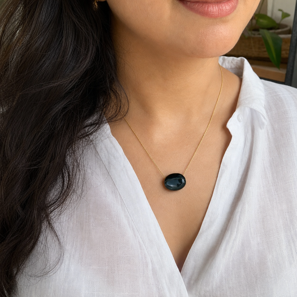 Sulemani Hakik woman wearing gemstone pendant