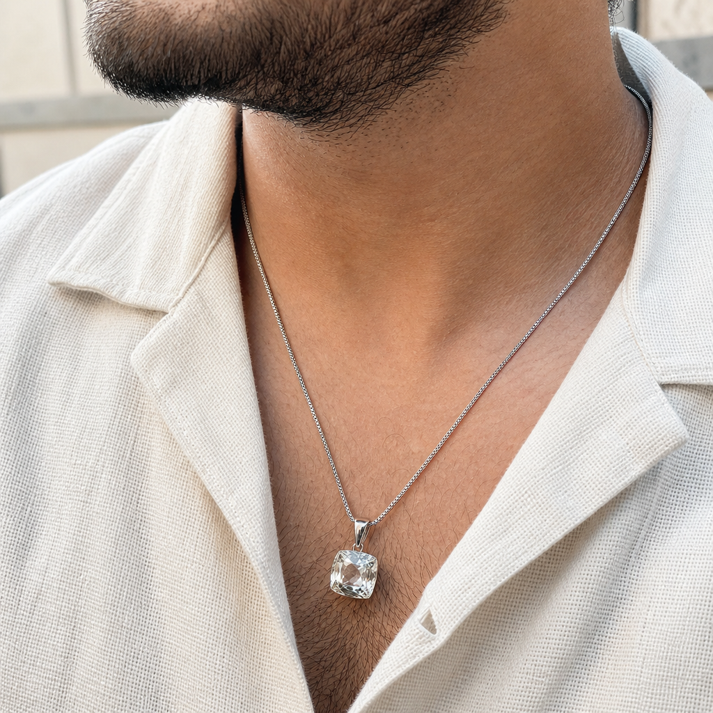White Pukhraj man wearing gemstone pendant