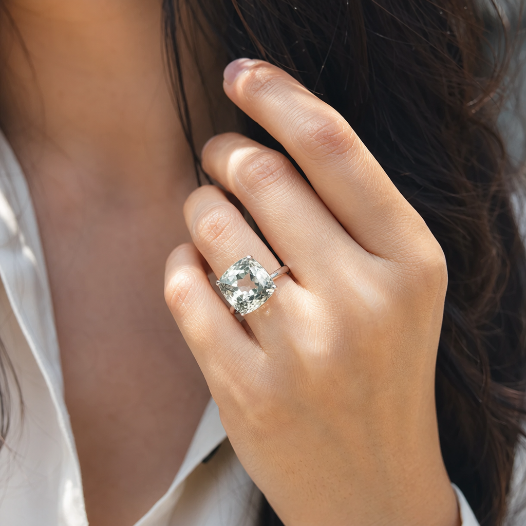 White Pukhraj woman wearing gemstone ring